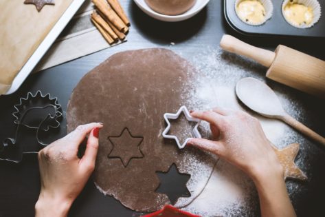 A person using a cookie cutter (which is exactly what you'll be doing by using a cover letter template!)