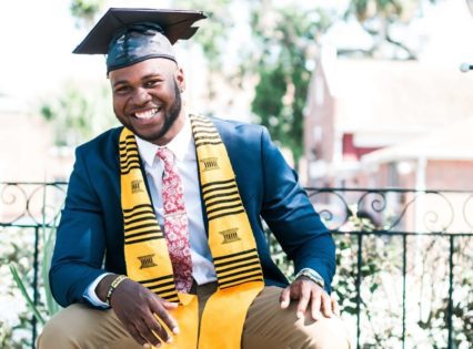 A photo of a smiling graduate with a graduation cap and tassel. Photo by nappy from Pexels.