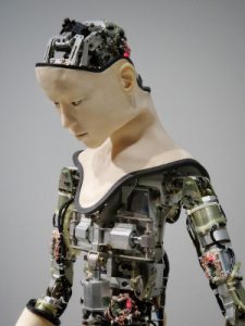 An image of a partially completed robot with a realistic human face, symbolizing the type of problem with being too afraid of AI in recruiting.