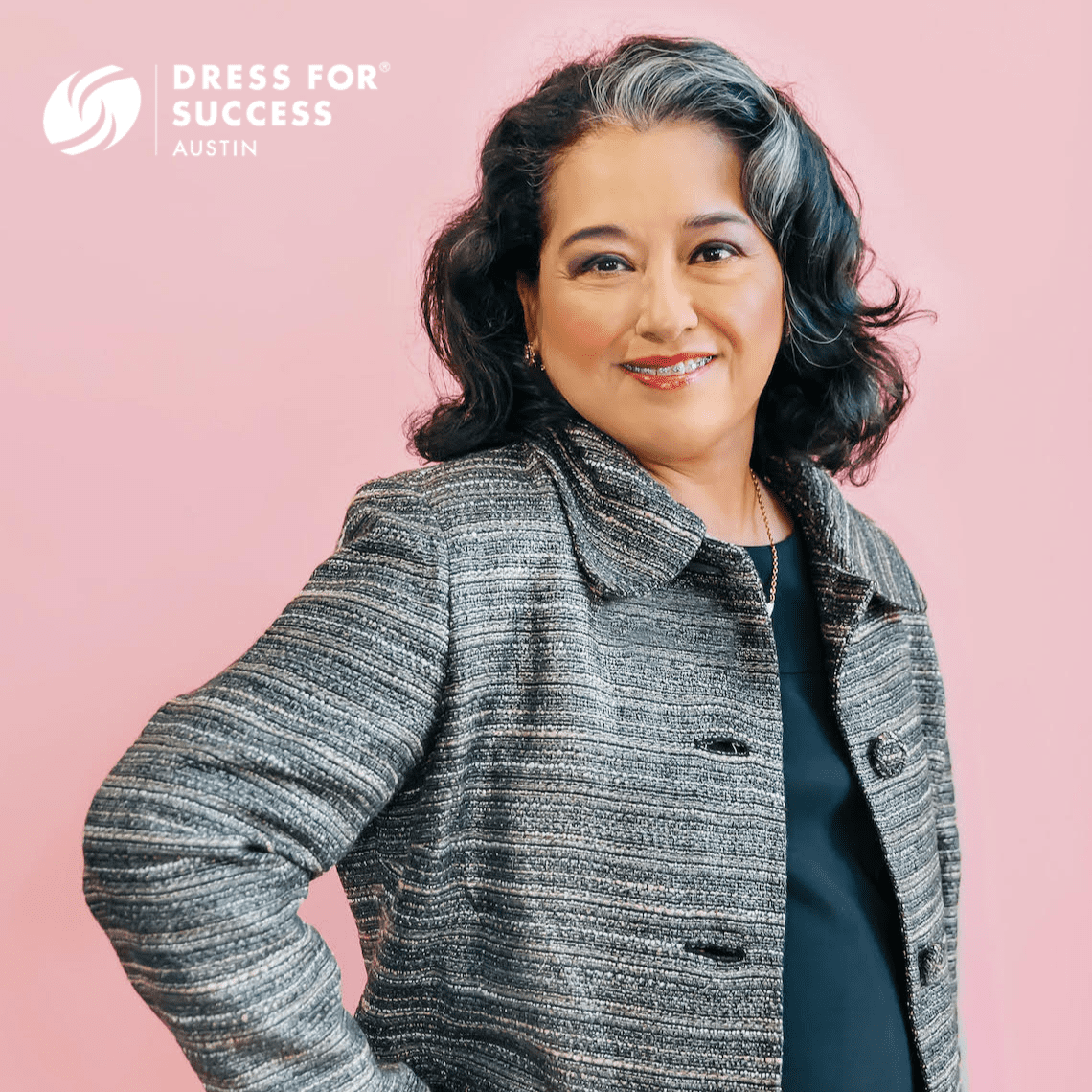 A promotional photo for Dress for Success America, featuring a successful client.