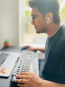 man looking at computer Photo by Abu Naser Ramim on Unsplash