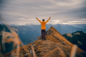 Person on mountain. Photo by Felipe Giacometti on Unsplash