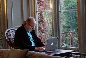 middle-aged man on computer. Photo by Beth Macdonald on Unsplash