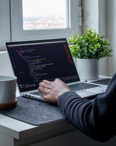 person coding. Photo by Nubelson Fernandes on Unsplash