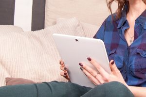 woman reading on screenPhoto by Tetiana SHYSHKINA on Unsplash