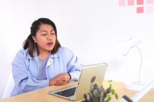 woman on computer meeting. Photo by Beci Harmony on Unsplash