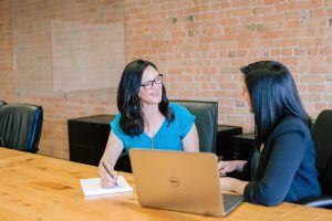 Photo two women negotiating. Amy Hirschi on Unsplash