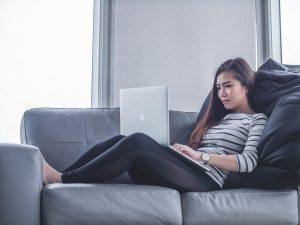 person on computer. Photo by Mimi Thian on Unsplash