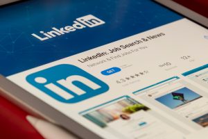 Somone downloading the LinkedIn app to strengthen their job search strategy Photo by Souvik Banerjee on Unsplash