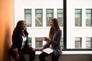 Two women in an informational meeting, which is a great job search strategy. Photo by Photo by Christina @ wocintechchat.com on Unsplash