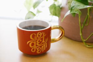 coffee cup says go get em. Say thanks 🙌 Give a shoutout to Kyle Glenn on social or copy the text below to attribute. Photo by Kyle Glenn on Unsplash