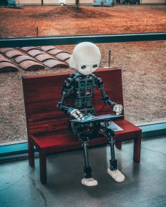 Robot reading a computer, which is not what resume screening software is. Photo by Andrea De Santis on Unsplash
