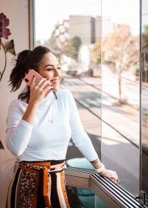 person on phone. Photo by Mateus Campos Felipe on Unsplash