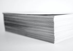 stack of paper showing a common resume myth. Photo by ron dyar on Unsplash
