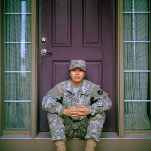 military person sitting. Photo by Jessica Radanavong on Unsplash