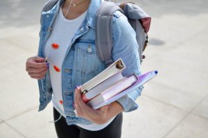 person carrying books