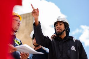 man in hard hat pointing