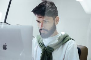 man looking at computer