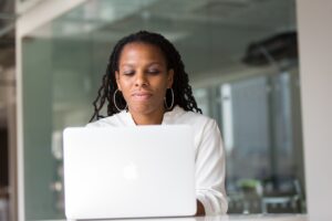 woman smiling at computer