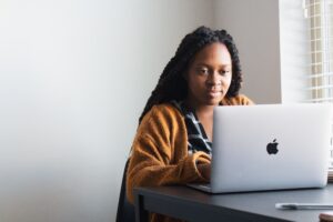 Woman smiling at computer