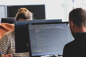 two people on computers