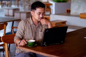 man looking at computer