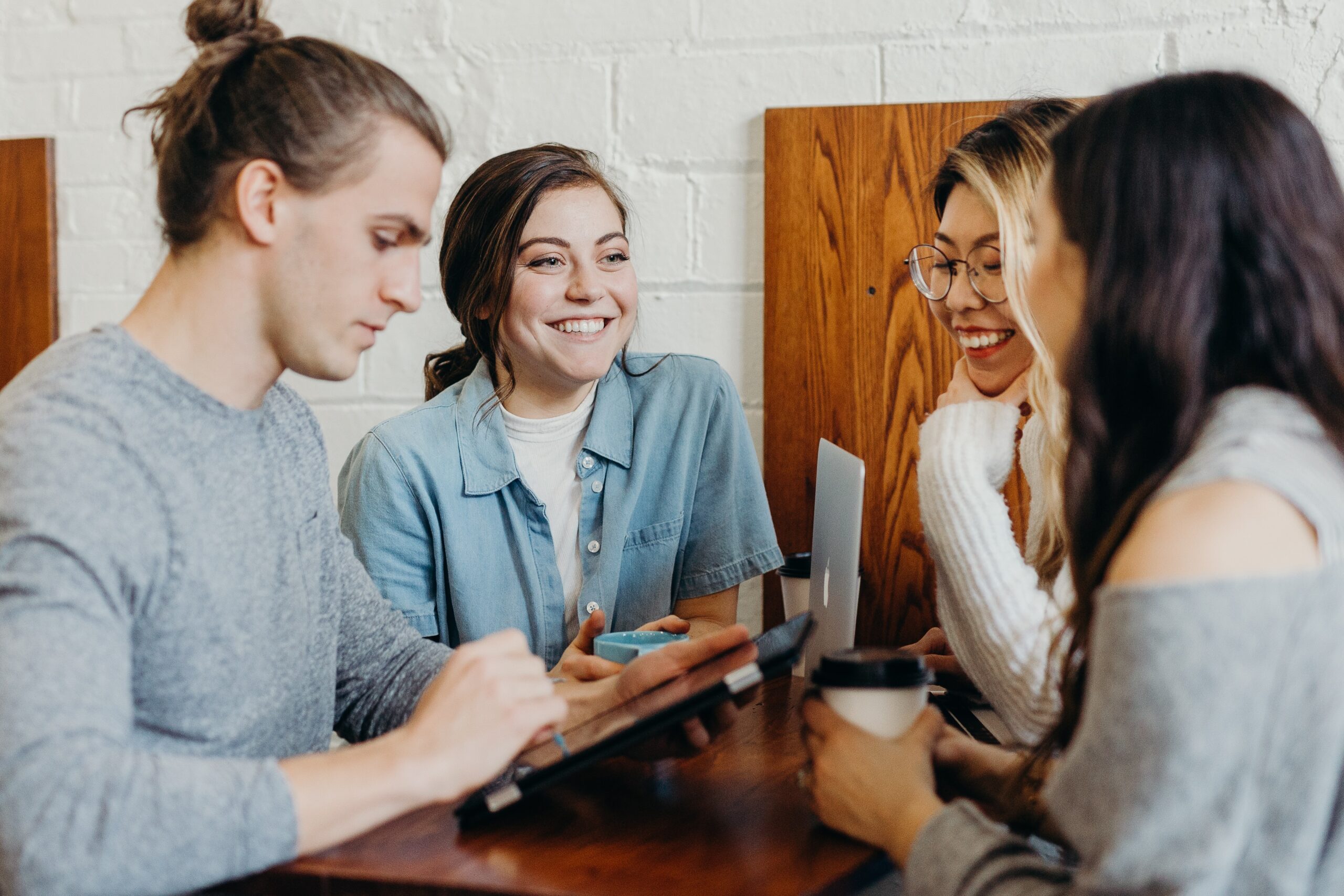 four people working together