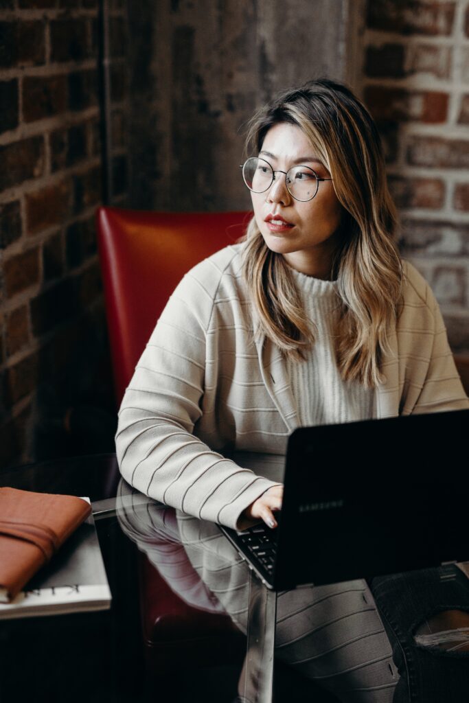 woman on computer looking away