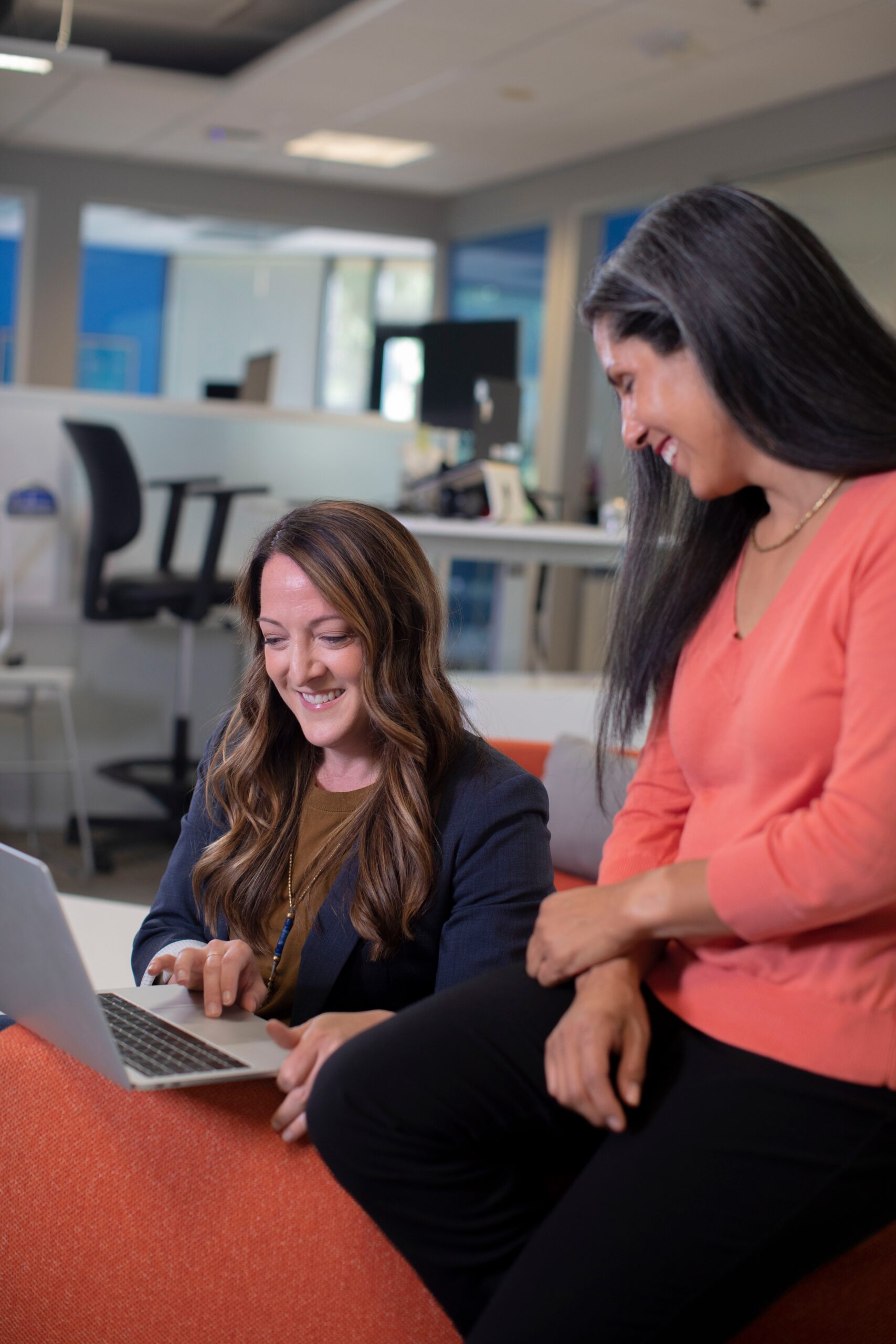 two women looking at a computer