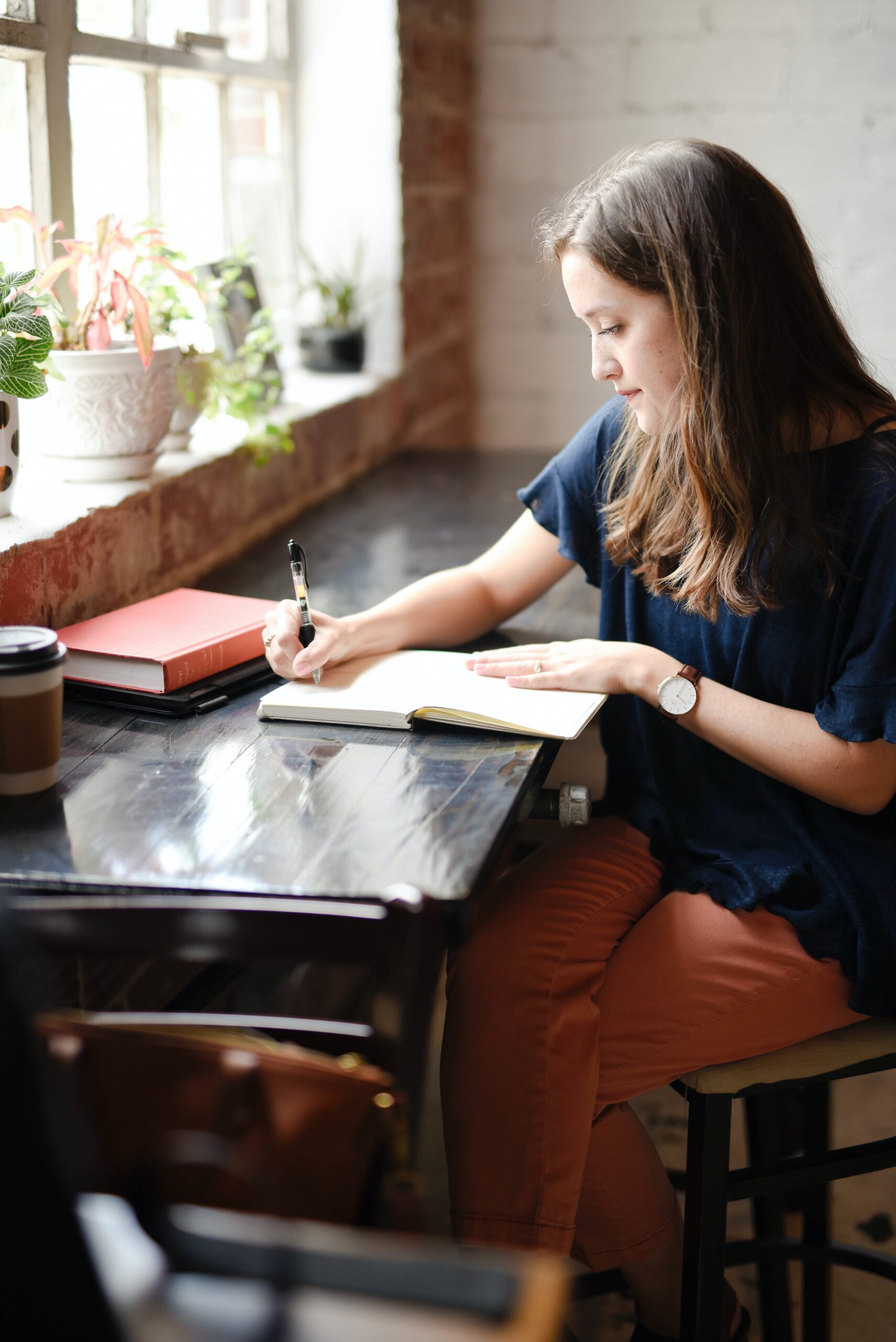 woman writing in a journal