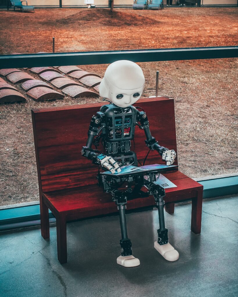 a robot sitting on a bench